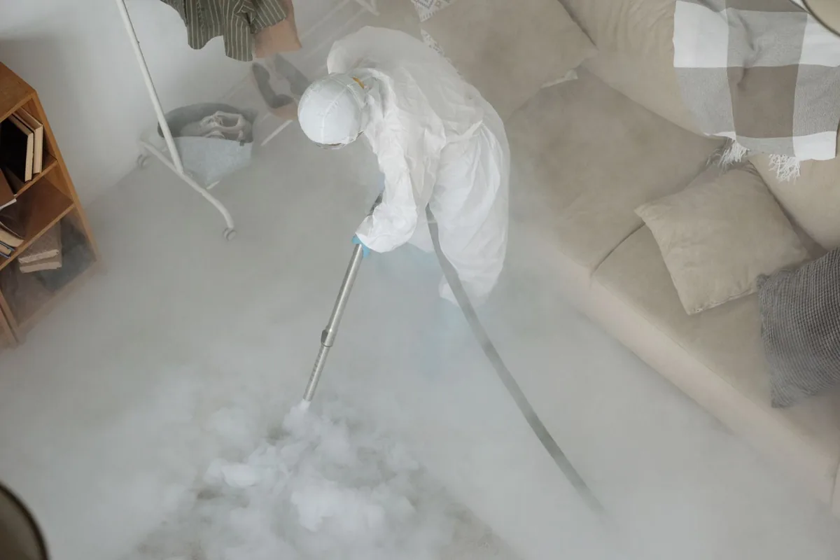 Biohazard cleanup technician in protective equipment, Brinckerhoff, NY
